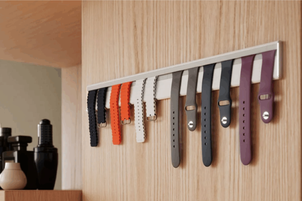 White Twelve South TimePorter wall mount bar holding six Apple Watch bands with chrome end caps and clean, minimal design.